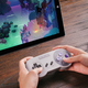 You can get the Super Nintendo-themed pad in both JAP/EU/AUS and American colour schemes.